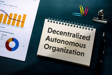 Poster - There is notebook with the word Decentralized Autonomous Organization. It is as an eye-catching image.