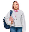 © Krakenimages.com - Hispanic woman with pink hair wearing student backpack and headphones with a happy and cool smile on face. lucky person.