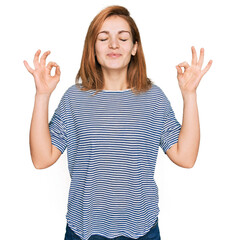 Poster - Young caucasian woman wearing casual clothes relax and smiling with eyes closed doing meditation gesture with fingers. yoga concept.