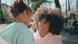 © stockbusters - African woman daughter enjoying time together in sunny park closeup. Family love
