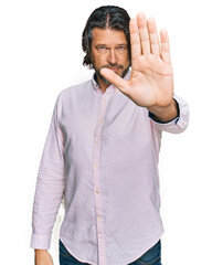 Poster - Middle age handsome man wearing business shirt doing stop sing with palm of the hand. warning expression with negative and serious gesture on the face.