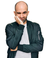 Poster - Young hispanic man wearing casual clothes thinking looking tired and bored with depression problems with crossed arms.