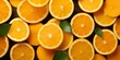 Freshly cut oranges with leaves, closely packed, top view. Ideal for food and beverage marketing, health and wellness content.