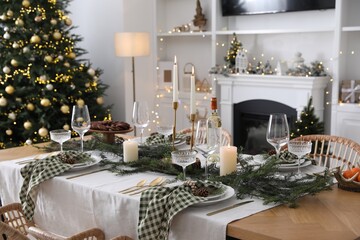 Canvas Print - Christmas table setting with festive decor and dishware in living room