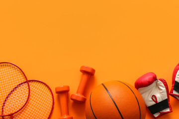 Wall Mural - Set of sports equipment on orange background