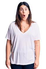 Sticker - Young beautiful brunette woman wearing casual t-shirt afraid and shocked with surprise expression, fear and excited face.