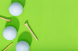 Golf background. Group of golf balls and tee on green background