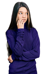 Poster - Young brunette girl with long hair wearing turtleneck sweater looking stressed and nervous with hands on mouth biting nails. anxiety problem.