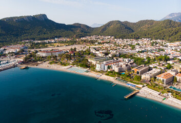 Wall Mural - Aerial photo of Kemer, seaside town in Turkey on Mediterranean coast, with view of Taurus Mountains in background.