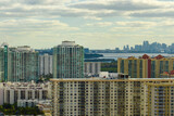 Fototapeta Nowy Jork - High angle view of Sunny Isles Beach city with expensive highrise hotels and condo buildings on Atlantic ocean shore. American tourism infrastructure in coastal southern Florida