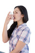 © vectorfusionart - Digital png photo of serious caucasian woman using inhaler on transparent background
