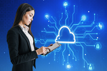 Aufkleber - Attractive young european businesswoman using tablet with creative digital circuit cloud on blue background. Data storage, server and technology concept.