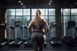 fat woman back view in gym
