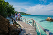© Fokke Baarssen - A couple of men and woman at Ko Kham tropical Island Sattahip Chonburi Samaesan Thailand