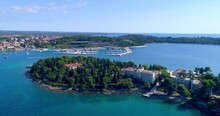 Rovinj, Croatia Aerial Push-in Shot Flying South Over Katerina Island Towards Hotel Marina