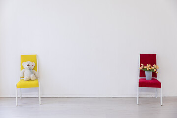 Poster - two colorful chairs in the interior of a white empty room