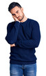 © Krakenimages.com - Young handsome man wearing casual clothes thinking looking tired and bored with depression problems with crossed arms.