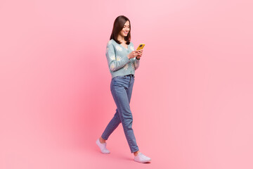 Wall Mural - full length body photo of young influencer blogging girl use phone wear denim jeans find tinder soul
