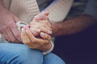 © Nicola Katie/peopleimages.com - Couple, holding hands and closeup with love and support with empathy for illness, diagnosis and cancer. Solidarity, man and woman with gratitude, hope or respect for partner with crisis in health