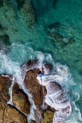 Wall Mural - aerial view of rocks and waves