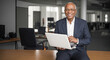 elderly afro american businessman with laptop. Senior businessman in suit using his laptop at workplace in modern office holding laptop in hands. Generative AI