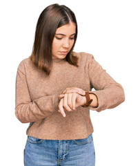 Poster - Young beautiful woman wearing casual clothes checking the time on wrist watch, relaxed and confident