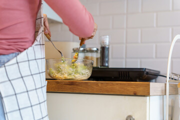 Asian woman preparing vegetable salad in the kitchen Healthy Food Healthy Cooking dieting Weight loss  homemade salad healthy