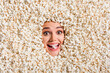 © deagreez - Above view photo of cheerful astonished overjoyed girl face buried isolated on background with full popcorn