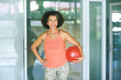Indoor portrait of happy fit mature woman holding soft ball, active and sport lifestyle