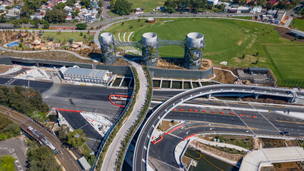 Wall Mural - Aerial drone view at Rozelle Interchange in Sydney, NSW Australia above the large chimney towers, shot on 3 December 2023 