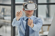 © Katsiaryna - businessman in virtual reality headset in the office