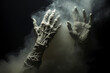 Zombie raises his hands up. Zombie hands in smoke. Undead crawls out of the ground. Veins on the arms. Horror. Halloween.