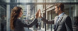 © Daniela - successful business concept. Bussiness people giving high five in modern interior.