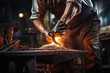 Close-up working powerful hands of male blacksmith forge an iron product in a blacksmith