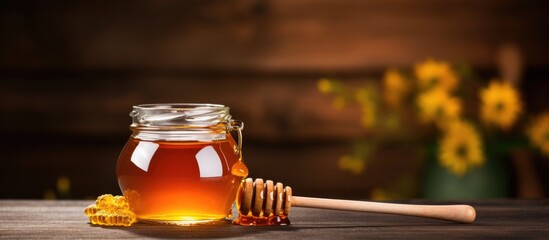 Aufkleber - Honey dipper on old wooden background with jar Copy space image Place for adding text or design