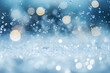 Cold snow falling background. Water drops and white ice blur bokeh. Sparkling blue background.