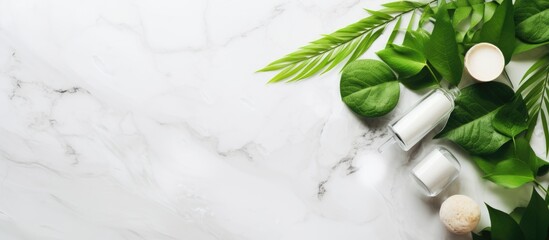 Organic skincare concept with green leaves and white stone background Copy space image Place for adding text or design