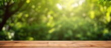 Nature Themed Background With A Wooden Table In A Garden Featuring Bokeh In A Spring Summer Setting The Wood Surface Is Versatile Serving As A Shelf Counter Desk And For Picnic Meals And Produc