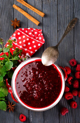 Canvas Print - Raspberry jam with berry on dark background.