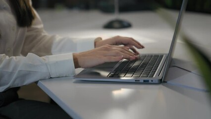 Unrecognizable woman office worker business female girl user businesswoman cropped view hands typing laptop keyboard computer working online job at table work corporate internet clients chat consult