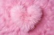 A fluffy pink fur heart shaped pillow with a soft texture on abstract cotton candy background