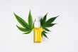 Cannabis oil and hemp leaf on white background, flat lay. Hemp CBD oil  for skin care.