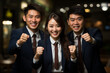 photo,three asian business people standing together with fists up, in the style of tsubasa nakai, uniformly staged images, language-based, soft-edged