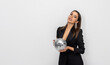 beautiful woman in black suit with shiny christmas disco ball in hand, on cyclorama background.wide banner for winter new year advertising.girl female leaning from high chair,minimalist