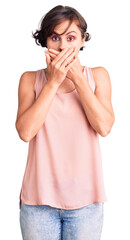 Wall Mural - Beautiful young woman with short hair wearing casual style with sleeveless shirt shocked covering mouth with hands for mistake. secret concept.