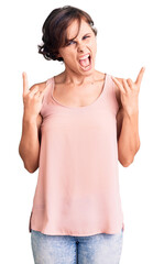 Sticker - Beautiful young woman with short hair wearing casual style with sleeveless shirt shouting with crazy expression doing rock symbol with hands up. music star. heavy concept.