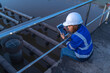 © reewungjunerr - Environmental engineers work at wastewater treatment plants,Water supply engineering working at Water recycling plant for reuse,Check the amount of chlorine in the water to be within the criteria.