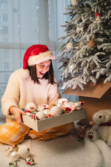 Poster - happy smiling woman decorating christmas tree