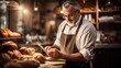© tilialucida - A man standing in front of a counter holding a cell phone. Bakery worker.