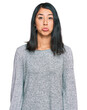 © Krakenimages.com - Beautiful asian young woman wearing casual clothes depressed and worry for distress, crying angry and afraid. sad expression.